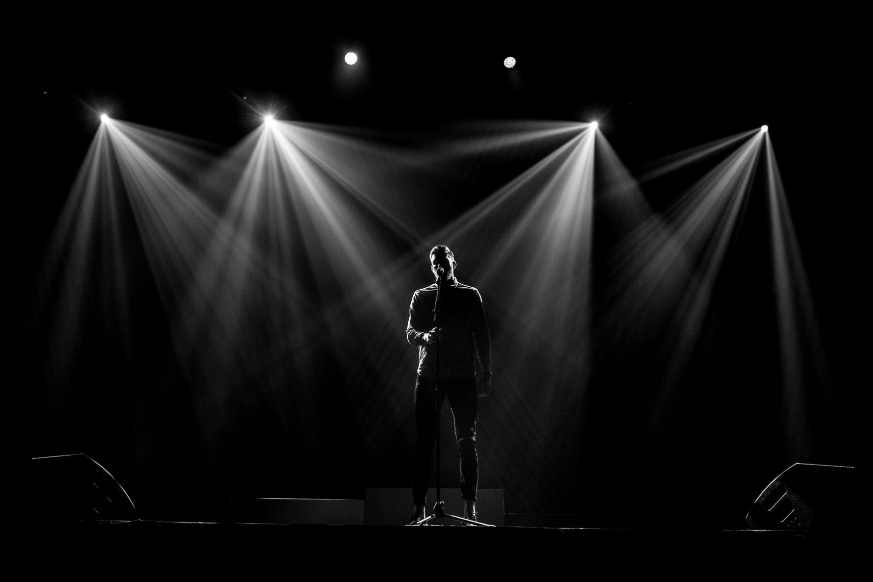 Chris on stage performing his hit spoken word piece "Find Your Coast" in Edmonton, Alberta.